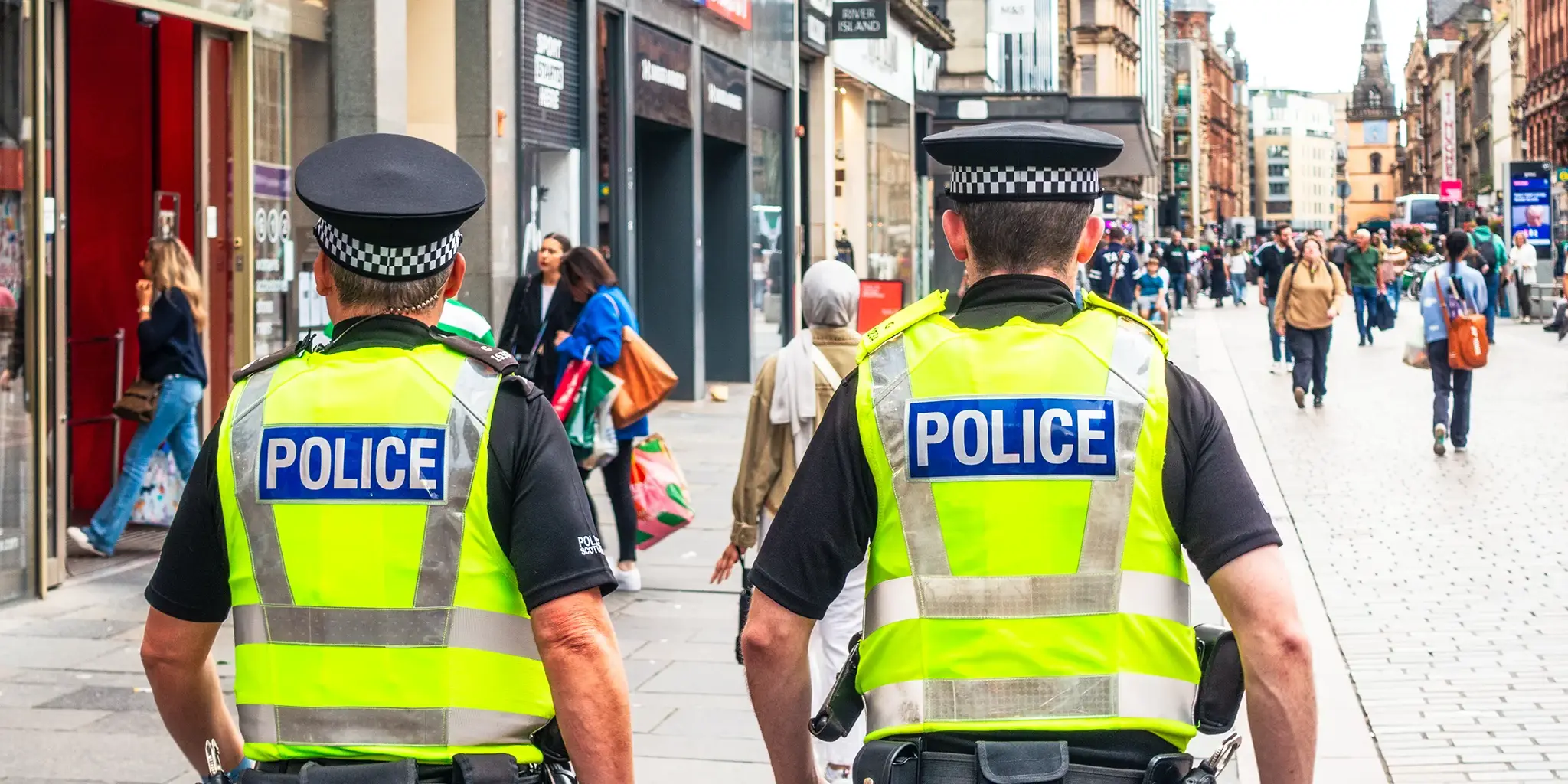 Police officers walking along a high street