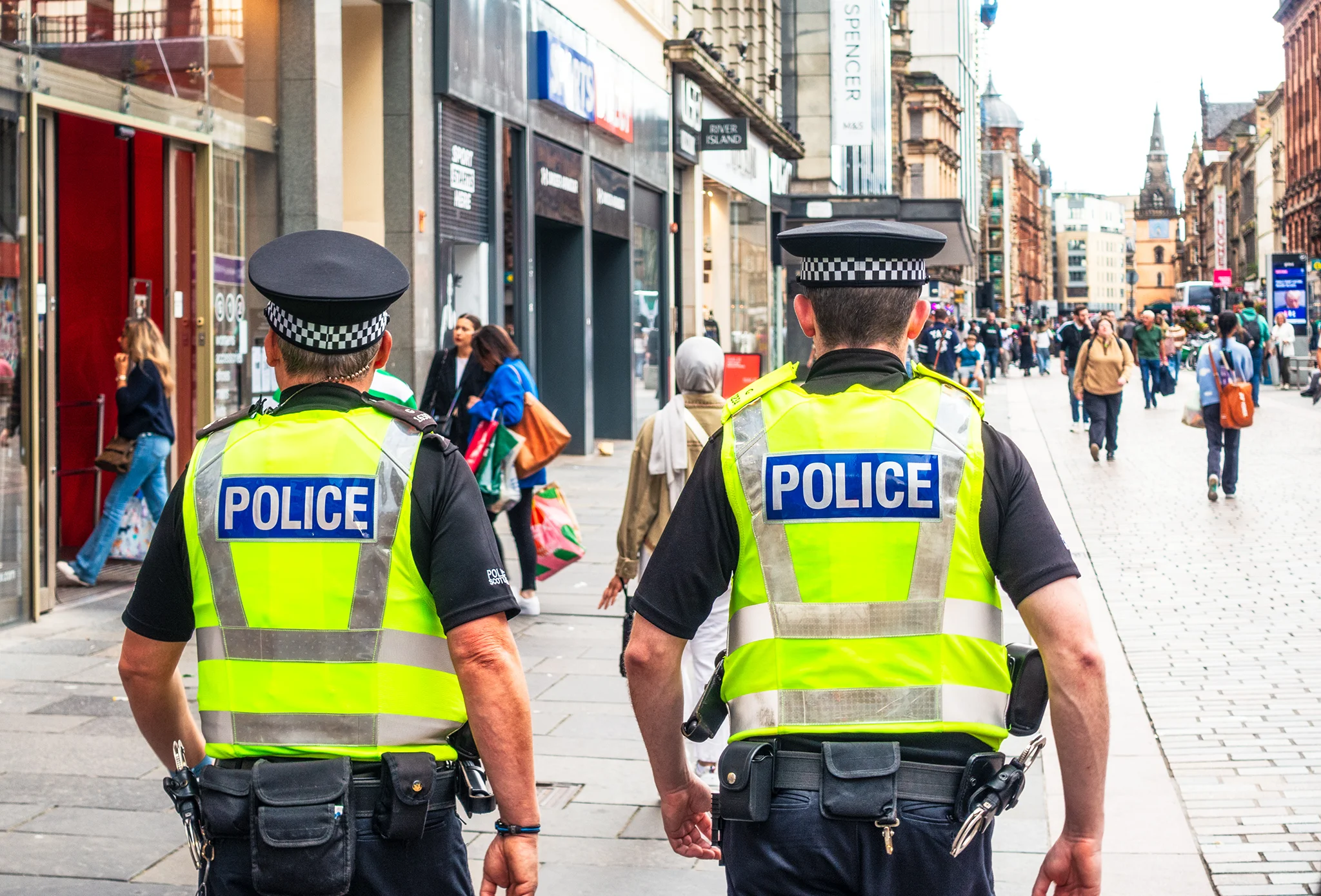 Police officers walking along a high street